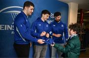 1 March 2025; Leinster players James Culhane, Cormac Foley and Michael Milne with supporters in Autograph Alley before the United Rugby Championship match between Leinster and Cardiff Rugby at the Aviva Stadium in Dublin. Photo by Seb Daly/Sportsfile