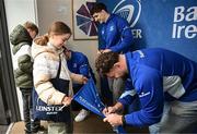 1 March 2025; Leinster players James Culhane, Cormac Foley and Michael Milne with supporters in Autograph Alley before the United Rugby Championship match between Leinster and Cardiff Rugby at the Aviva Stadium in Dublin. Photo by Seb Daly/Sportsfile