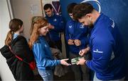 1 March 2025; Leinster players James Culhane, Cormac Foley and Michael Milne with supporters in Autograph Alley before the United Rugby Championship match between Leinster and Cardiff Rugby at the Aviva Stadium in Dublin. Photo by Seb Daly/Sportsfile