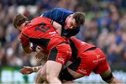 1 March 2025; Diarmuid Mangan of Leinster is tackled by Cardiff players Rory Jennings, left, and Alun Lawrence during the United Rugby Championship match between Leinster and Cardiff Rugby at the Aviva Stadium in Dublin. Photo by Seb Daly/Sportsfile