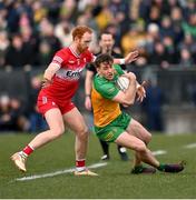 2 March 2025; Hugh McFadden of Donegal in action against Conor Glass of Derry during the Allianz Football League Division 1 match between Donegal and Derry at Fr Tierney Park in Ballyshannon, Donegal. Photo by Ramsey Cardy/Sportsfile