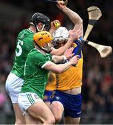 2 March 2025; Aidan McCarthy of Clare in action against Diarmaid Byrnes and Adam English of Limerick during the Allianz Hurling League Division 1A match between Limerick and Clare at TUS Gaelic Grounds in Limerick. Photo by Brendan Moran/Sportsfile