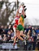 2 March 2025; Shane McGuigan of Derry in action against Ciaran Thompson and Ciaran Moore of Donegal during the Allianz Football League Division 1 match between Donegal and Derry at Fr Tierney Park in Ballyshannon, Donegal. Photo by Ramsey Cardy/Sportsfile