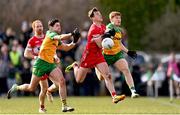2 March 2025; Shane McGuigan of Derry in action against Ciaran Moore of Donegal during the Allianz Football League Division 1 match between Donegal and Derry at Fr Tierney Park in Ballyshannon, Donegal. Photo by Ramsey Cardy/Sportsfile