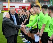 1 March 2025; President of Ireland Michael D Higgins in the company of FAI President Paul Cooke meets assistant referee Dylan Redmond before the 2025 Women's President's Cup match between Shelbourne and Athlone Town at Tolka Park in Dublin. Photo by Stephen McCarthy/Sportsfile