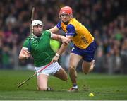 2 March 2025; Darragh Lohan of Clare in action against Aaron Gillane of Limerick during the Allianz Hurling League Division 1A match between Limerick and Clare at TUS Gaelic Grounds in Limerick. Photo by John Sheridan/Sportsfile