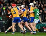 2 March 2025; Diarmaid Byrnes of Limerick, second from left, tussles with Clare players Darragh Lohan and Adam Hogan of Clare after an incident for which he was shown a red card during the Allianz Hurling League Division 1A match between Limerick and Clare at TUS Gaelic Grounds in Limerick. Photo by Brendan Moran/Sportsfile