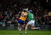 2 March 2025; Jack O'Neill of Clare is tackled by Mike Casey of Limerick during the Allianz Hurling League Division 1A match between Limerick and Clare at TUS Gaelic Grounds in Limerick. Photo by Brendan Moran/Sportsfile