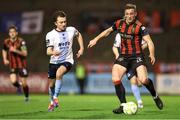 3 March 2025; John Mountney of Bohemians in action against Darragh Markey of Drogheda United during the SSE Airtricity Men's Premier Division match between Bohemians and Drogheda United at Dalymount Park in Dublin. Photo by Thomas Flinkow/Sportsfile
