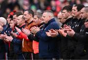 1 March 2025; Cork players and management during a minute's applause for Ray Ryan, who died recently, brother of Cork manager Pat Ryan before the Allianz Hurling League Division 1A match between Cork and Kilkenny at SuperValu Páirc Uí Chaoimh in Cork. Photo by Piaras Ó Mídheach/Sportsfile