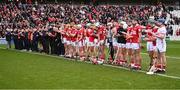 1 March 2025; Cork players and management during a minute's applause for Ray Ryan, who died recently, brother of Cork manager Pat Ryan before the Allianz Hurling League Division 1A match between Cork and Kilkenny at SuperValu Páirc Uí Chaoimh in Cork. Photo by Piaras Ó Mídheach/Sportsfile