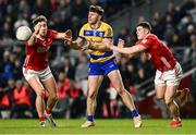 1 March 2025; Diarmuid Murtagh of Roscommon in action against Paul Walsh, left, and Rory Maguire of Cork during the Allianz Football League Division 2 match between Cork and Roscommon at SuperValu Páirc Uí Chaoimh in Cork. Photo by Piaras Ó Mídheach/Sportsfile
