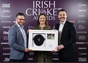 6 March 2025; Clare Shillington is presented with the Hall of Fame award, supported by Corpay, by Finian Brett, left, and Darren Cave of Corpay during the Business Plus Irish Cricket Awards at The College Green Hotel in Dublin. Photo by Seb Daly/Sportsfile