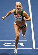 7 March 2025; Sarah Lavin of Ireland crosses the finish line to finish second in the women's 60m hurdles semi-final during day two of the European Athletics Indoor Championships 2025 at the Omnisport Apeldoorn in Apeldoorn, Netherlands. Photo by Sam Barnes/Sportsfile