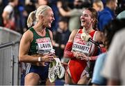 7 March 2025; Sarah Lavin of Ireland, left, shares a joke with Karin Strametz of Austria after finishing second in the women's 60m hurdles semi-final during day two of the European Athletics Indoor Championships 2025 at the Omnisport Apeldoorn in Apeldoorn, Netherlands. Photo by Sam Barnes/Sportsfile