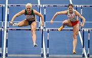 7 March 2025; Sarah Lavin of Ireland, left, competes in the women's 60m hurdles semi-final during day two of the European Athletics Indoor Championships 2025 at the Omnisport Apeldoorn in Apeldoorn, Netherlands. Photo by Sam Barnes/Sportsfile