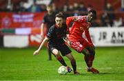 7 March 2025; Darragh Markey of Drogheda United in action against Mipo Odubeko of Shelbourne during the SSE Airtricity Men's Premier Division match between Shelbourne and Drogheda United at Tolka Park in Dublin. Photo by Seb Daly/Sportsfile