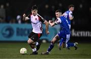 7 March 2025; Andy Paraschiv of Dundalk in action against Lee Devitt of Treaty United during the SSE Airtricity Men's Premier Division match between Dundalk and Treaty United at Oriel Park in Dundalk, Louth. Photo by Ben McShane/Sportsfile