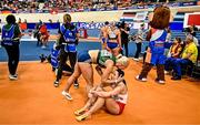 7 March 2025; Sarah Lavin of Ireland, left, embraces Luca Kozák of Hungary after the women's 60m hurdles final during day two of the European Athletics Indoor Championships 2025 at the Omnisport Apeldoorn in Apeldoorn, Netherlands. Photo by Sam Barnes/Sportsfile
