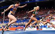7 March 2025; Sarah Lavin of Ireland, centre, crosses the finish line to finish fourth in the women's 60m hurdles final during day two of the European Athletics Indoor Championships 2025 at the Omnisport Apeldoorn in Apeldoorn, Netherlands. Photo by Sam Barnes/Sportsfile
