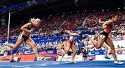 7 March 2025; Sarah Lavin of Ireland, left, crosses the finish line to finish fourth in the women's 60m hurdles final during day two of the European Athletics Indoor Championships 2025 at the Omnisport Apeldoorn in Apeldoorn, Netherlands. Photo by Sam Barnes/Sportsfile