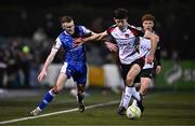 7 March 2025; Sean McHale of Dundalk in action against Lee Devitt of Treaty United during the SSE Airtricity Men's Premier Division match between Dundalk and Treaty United at Oriel Park in Dundalk, Louth. Photo by Ben McShane/Sportsfile