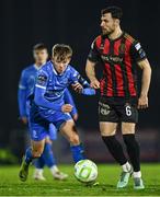 7 March 2025; Jordan Flores of Bohemians in action against Conan Noonan of Waterford during the SSE Airtricity Men's Premier Division match between Waterford and Bohemians at the Regional Sports Centre in Waterford. Photo by Piaras Ó Mídheach/Sportsfile