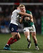 7 March 2025; Clark Logan of Ireland is tackled by Jean Cotarmanac'h of France during the U20 Six Nations Rugby Championship match between Ireland and France at Virgin Media Park in Cork. Photo by Brendan Moran/Sportsfile
