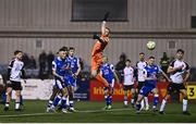 7 March 2025; Lee Devitt of Treaty United, centre, scores his side's second goal past Dundalk goalkeeper Peter Cherrie during the SSE Airtricity Men's Premier Division match between Dundalk and Treaty United at Oriel Park in Dundalk, Louth. Photo by Ben McShane/Sportsfile