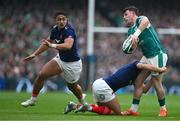 8 March 2025; Calvin Nash of Ireland is tackled by Louis Bielle-Biarrey of France during the Guinness Six Nations Rugby Championship match between Ireland and France at the Aviva Stadium in Dublin. Photo by Brendan Moran/Sportsfile