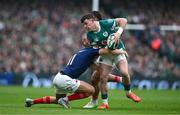 8 March 2025; Calvin Nash of Ireland is tackled by Louis Bielle-Biarrey of France during the Guinness Six Nations Rugby Championship match between Ireland and France at the Aviva Stadium in Dublin. Photo by Brendan Moran/Sportsfile