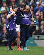 8 March 2025; Antoine Dupont of France is assisted from the pitch after sustaining an injury during the Guinness Six Nations Rugby Championship match between Ireland and France at the Aviva Stadium in Dublin. Photo by Seb Daly/Sportsfile