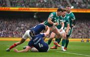 8 March 2025; Calvin Nash of Ireland is tackled by Louis Bielle-Biarrey, left, and Thibaud Flament of France during the Guinness Six Nations Rugby Championship match between Ireland and France at the Aviva Stadium in Dublin. Photo by Brendan Moran/Sportsfile