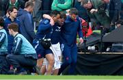 8 March 2025; Antoine Dupont of France is assisted from the pitch after sustaining an injury during the Guinness Six Nations Rugby Championship match between Ireland and France at the Aviva Stadium in Dublin. Photo by Brendan Moran/Sportsfile