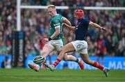 8 March 2025; Jamie Osborne of Ireland in action against Louis Bielle-Biarrey of France during the Guinness Six Nations Rugby Championship match between Ireland and France at the Aviva Stadium in Dublin. Photo by Brendan Moran/Sportsfile