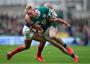8 March 2025; Jamie Osborne of Ireland is tackled by Maxime Lucu of France during the Guinness Six Nations Rugby Championship match between Ireland and France at the Aviva Stadium in Dublin. Photo by Brendan Moran/Sportsfile