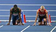 8 March 2025; Bori Akinola of Ireland, left, and Simon Hansen of Denmark before competing in the men's 60m semi-final during day three of the European Athletics Indoor Championships 2025 at the Omnisport Apeldoorn in Apeldoorn, Netherlands. Photo by Sam Barnes/Sportsfile