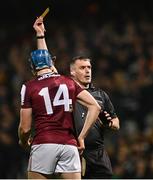 8 March 2025; Referee James Owens shows the yellow card to Conor Cooney of Galway, for a tackle on Mike Casey of Limerick, during the Allianz Hurling League Division 1A match between Limerick and Galway at TUS Gaelic Grounds in Limerick. Photo by Piaras Ó Mídheach/Sportsfile