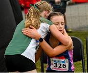 8 March 2025; Lily Walsh of Loreto Mullingar and Aoife Murphy of Loreto Foxrock after competing in the Junior Girls 2,500m during the 123.ie All Ireland Schools Cross Country Championships at Galway Racecourse in Ballybrit, Galway. Photo by Tom Beary/Sportsfile