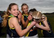 8 March 2025; Freya Rrenton, left, Aoibhinn McNamar, Erin Walsh of SHS Westport celebrates with the team event cup after the Intermediate Girls 3,500m during the 123.ie All Ireland Schools Cross Country Championships at Galway Racecourse in Ballybrit, Galway. Photo by Tom Beary/Sportsfile