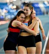 9 March 2025; Amy Jo Kierans of Oriel AC, Monaghan, left, and Saoirse Fitzgerald of Lucan Harriers A.C., Dublin embrace after the womens u20 400m heats during the 123.ie National U20 & U23 Indoor Championships at the TUS International arena in Athlone, Westmeath. Photo by Tyler Miller/Sportsfile