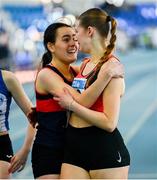 9 March 2025; Amy Jo Kierans of Oriel AC, Monaghan, left, and Saoirse Fitzgerald of Lucan Harriers A.C., Dublin embrace after the womens u20 400m heats during the 123.ie National U20 & U23 Indoor Championships at the TUS International arena in Athlone, Westmeath. Photo by Tyler Miller/Sportsfile