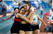 9 March 2025; Amy Jo Kierans of Oriel AC, Monaghan, left, and Saoirse Fitzgerald of Lucan Harriers A.C., Dublin embrace after the womens u20 400m heats during the 123.ie National U20 & U23 Indoor Championships at the TUS International arena in Athlone, Westmeath. Photo by Tyler Miller/Sportsfile
