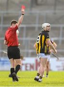 9 March 2025; Jordan Molloy of Kilkenny is shown a red card by referee Sean Stack during the Allianz Hurling League Division 1A match between Kilkenny and Tipperary at UPMC Nowlan Park in Kilkenny. Photo by Stephen McCarthy/Sportsfile