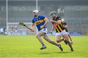 9 March 2025; Craig Morgan of Tipperary on his way to scoring his side's first goal despite the attention of Tommy Walsh of Kilkenny during the Allianz Hurling League Division 1A match between Kilkenny and Tipperary at UPMC Nowlan Park in Kilkenny. Photo by Stephen McCarthy/Sportsfile