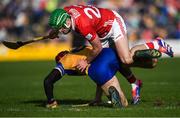 9 March 2025; John Conlon of Clare is tackled by Tommy O'Connell of Cork during the Allianz Hurling League Division 1A match between Clare and Cork at Zimmer Biomet Páirc Chíosóg in Ennis, Clare. Photo by John Sheridan/Sportsfile