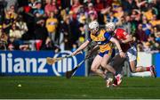 9 March 2025; Adam Hogan of Clare in action against Patrick Horgan of Cork during the Allianz Hurling League Division 1A match between Clare and Cork at Zimmer Biomet Páirc Chíosóg in Ennis, Clare. Photo by John Sheridan/Sportsfile