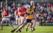 9 March 2025; Cathal Malone of Clare in action against Darragh Fitzgibbon of Cork during the Allianz Hurling League Division 1A match between Clare and Cork at Zimmer Biomet Páirc Chíosóg in Ennis, Clare. Photo by Piaras Ó Mídheach/Sportsfile