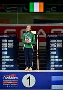 9 March 2025; Sarah Healy of Ireland with her gold medal while listening to her national anthem after winning the women's 3000m final on day four of the European Athletics Indoor Championships 2025 at the Omnisport Apeldoorn in Apeldoorn, Netherlands. Photo by Sam Barnes/Sportsfile