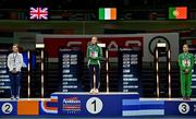 9 March 2025; Sarah Healy of Ireland stand for her national anthem with her gold medal after winning the women's 3000m final, in the company of silver medallist Melissa Courtney-Bryant of Great Britain and bronze medallist Salomé Afonso of Portugal, on day four of the European Athletics Indoor Championships 2025 at the Omnisport Apeldoorn in Apeldoorn, Netherlands. Photo by Sam Barnes/Sportsfile